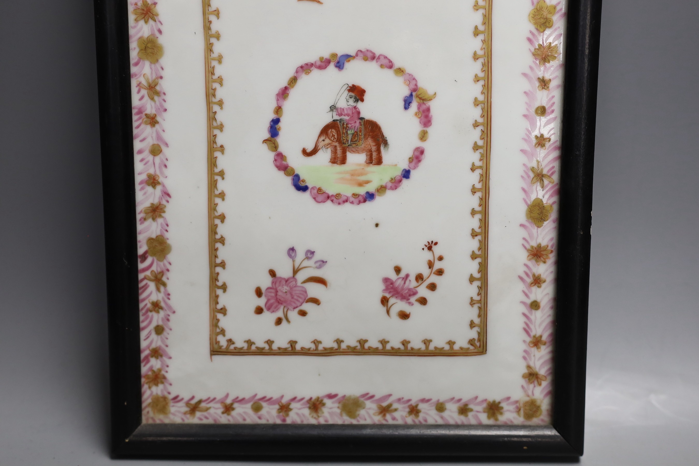 A framed Chinese export style famille rose porcelain plaque, 25x17cm